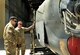 Tech. Sgt. Christopher Poole, 455th Maintenance Group engine manager, informs Staff Sgt. Christopher Contreras, 455th Aircraft Maintenance Squadron C-130 maintainer, what parts of an engine need to be cleaned, prior to a customs inspection on Bagram Airfield, Afghanistan, May 13, 2012. Poole is deployed from Barksdale Air Force Base, La. (U.S. Air Force photo/ Staff Sgt. Stephenie Wade)