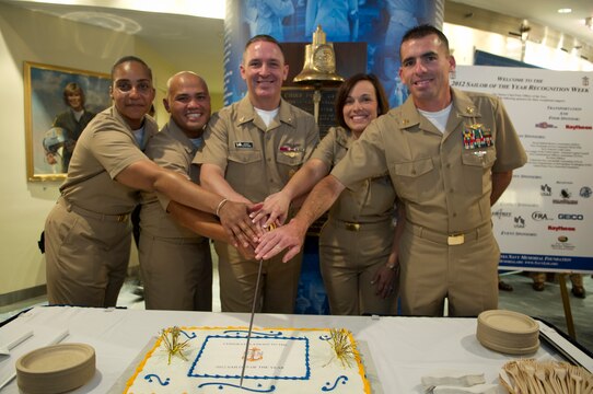 Master Chief Petty Officer of the Navy (MCPON) Michael D. Stevens, center, and the four 2012 Sailors of the Year cut a cake after the 2012 Sailor of the Year pinning ceremony. The Sailors of the Year were meritoriously promoted to chief petty officer by Vice Chief of Naval Operations Adm. Mark E. Ferguson. 
