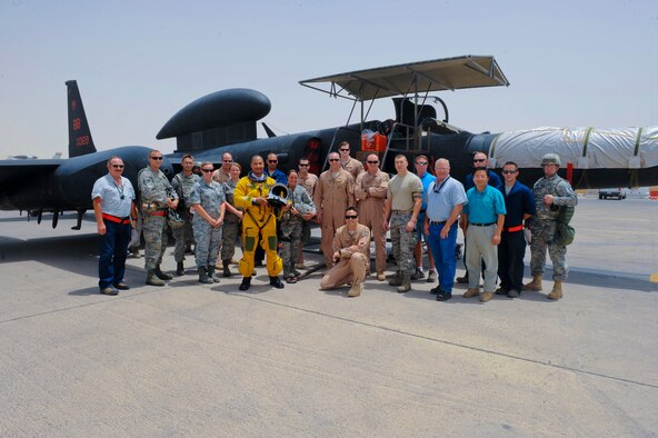 U.S. Air Force Maj. Patrick Hudson (center), 99th Expeditionary Reconnaissance Squadron U-2 pilot, takes a group photo with fellow members of the 99th ERS. During the flight, Hudson reached a milestone of 2,000 U-2 hours Hudson hails from Fayette, Miss., and is deployed from Beale Air Force Base, Calif. (U.S. Air Force photo by Staff Sgt. Joshua J. Garcia)