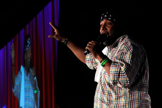 Alex Scott, the host for the Leatherneck Comedy Tour, warms up the audience, just before welcoming his first comedian to the stage during Camp Pendleton’s second visit Leatherneck Comedy Tour here May 17.