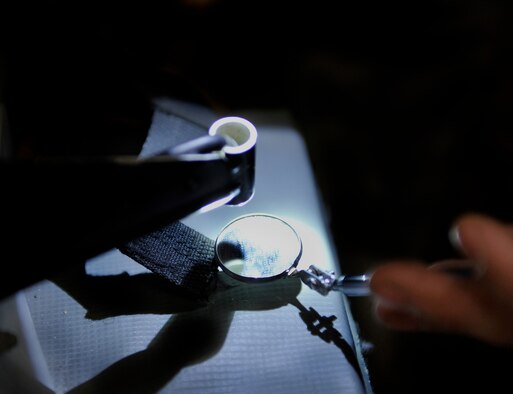 Senior Airman Garron Theriault, 455th Expeditionary Maintenance Squadron egress technician, uses a mirror to examine an A-10 Thunderbolt II aircraft seat for cracks during an inspection on Bagram Airfield, Afghanistan, May 17, 2013. Aircrew egress system technicians ensure the safety of 74th Expeditionary Fighter Squadron pilots by inspecting and performing preventative maintenance on the egress systems and components of the A-10. A-10s from Bagram fly daily to provide close air support to forces operating in Afghanistan. Theriault is from Harrison, Maine. ( U.S. Air Force photo/ Staff Sgt/ Stephenie Wade) 