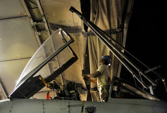 Staff Sgt. Keith Billings, 455th Expeditionary Maintenance Squadron egress technician, uses a crane and a sling to remove an Advanced Concept Ejection System, otherwise known as the pilot ejection seat, from an A-10 Thunderbolt II aircraft on Bagram Airfield, Afghanistan, May 17, 2013. The Airmen are completing a phase inspection, which requires a full  inspection of the removed seat, cockpit components and repair any discrepancies. Billings is deployed from Moody Air Force Base, Ga.  Billings is from Prattville, Ala. 
