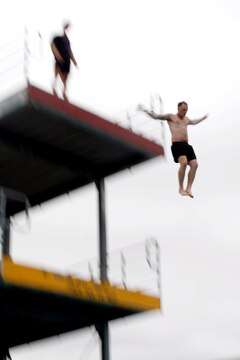 Cpl. Benjamin Walker leaped off of the 35-foot tower at the 53-Area pool during the 5th Annual Recon Challenge here May 17. The challenge consisted of a 2,000-meter swim, calisthenics tests and other skill based events.
