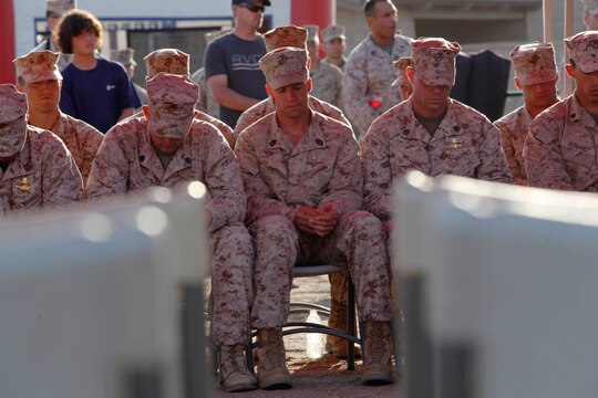 Marines have a moment of silence in honor of their deceased recon brothers during the 5th Annual Recon Challenge award ceremony here May 17. The challenge consisted of a 2,000-meter swim, calisthenics tests and other skill based events.
