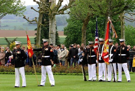 Marines from the 5th Marine Regiment stand at parade-rest during the Memorial Day ceremony at Aisne-Marne American Cemetery, May 26. To celebrate Memorial Day, and to mark the 95th anniversary of the historic Battle of Belleau Wood, U.S. Marines with their French counterparts gathered at Aisne-Marne American Cemetery to commemorate their fallen heroes, May 26. The event was held in the memorial cemetery that lies outside of the historic grounds of Belleau Wood and featured the laying of wreathes, a firing of volleys, the playing of TAPS, raising of the American and French national colors, and a concert by the French military band. The mayor of the village of Bellau along with other military officers and officials representing the U.S. and France were present. Participating units from the U.S. Marines included 5th Marine Regiment, Marine Security Guard Detachment, the Wounded Warrior Regiment and Marine Forces Europe and Africa. French units that participated in the ceremony included the 21st Marine Infantry Regiment and the Musique Principale des Troupes de Marines. 
