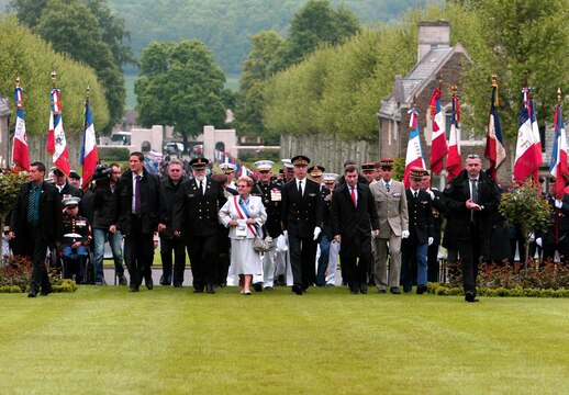 Mayor of Belleau Monique Benier along with military officers and officials representing the U.S. and France for the official party, enter the Memorial Day ceremony, May 26. To celebrate Memorial Day, and to mark the 95th anniversary of the historic Battle of Belleau Wood, U.S. Marines with their French counterparts gathered at Aisne-Marne American Cemetery to commemorate their fallen heroes, May 26. The event was held in the memorial cemetery that lies outside of the historic grounds of Belleau Wood and featured the laying of wreathes, a firing of volleys, the playing of TAPS, raising of the American and French national colors, and a concert by the French military band. The mayor of the village of Bellau along with other military officers and officials representing the U.S. and France were present. Participating units from the U.S. Marines included 5th Marine Regiment, Marine Security Guard Detachment, the Wounded Warrior Regiment and Marine Forces Europe and Africa. French units that participated in the ceremony included the 21st Marine Infantry Regiment and the Musique Principale des Troupes de Marines. 
