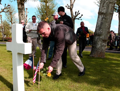 Marines from U.S. Marine Corps Forces Europe set-up the grounds of Aisne-Marne American Cemetery for the next day’s Memorial Day ceremony by placing American and French flags on each of the 2,289 epitaphs and marking the graves of the fallen Marines and sailors with flowers. To celebrate Memorial Day, and to mark the 95th anniversary of the historic Battle of Belleau Wood, U.S. Marines with their French counterparts gathered at Aisne-Marne American Cemetery to commemorate their fallen heroes, May 26. The event was held in the memorial cemetery that lies outside of the historic grounds of Belleau Wood and featured the laying of wreathes, a firing of volleys, the playing of TAPS, raising of the American and French national colors, and a concert by the French military band. The mayor of the village of Bellau along with other military officers and officials representing the U.S. and France were present. Participating units from the U.S. Marines included 5th Marine Regiment, Marine Security Guard Detachment, the Wounded Warrior Regiment and Marine Forces Europe and Africa. French units that participated in the ceremony included the 21st Marine Infantry Regiment and the Musique Principale des Troupes de Marines. 
