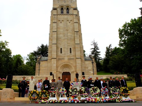 The Memorial Day ceremony, that included the laying-of-wreathes in tribute of the fallen troops at the Battle of Belleau Wood, was held in front of the Romanesque chapel of Aisne-Marne American Cemetery. To celebrate Memorial Day, and to mark the 95th anniversary of the historic Battle of Belleau Wood, U.S. Marines with their French counterparts gathered at Aisne-Marne American Cemetery to commemorate their fallen heroes, May 26. The event was held in the memorial cemetery that lies outside of the historic grounds of Belleau Wood and featured the laying of wreathes, a firing of volleys, the playing of TAPS, raising of the American and French national colors, and a concert by the French military band. The mayor of the village of Bellau along with other military officers and officials representing the U.S. and France were present. Participating units from the U.S. Marines included 5th Marine Regiment, Marine Security Guard Detachment, the Wounded Warrior Regiment and Marine Forces Europe and Africa. French units that participated in the ceremony included the 21st Marine Infantry Regiment and the Musique Principale des Troupes de Marines. 
