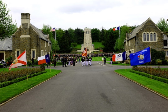 The Marine detail from 5th Marine Regiment marches off of the parade field after a Memorial Day ceremony at Aisne-Marne American Cemetery, May 26. To celebrate Memorial Day, and to mark the 95th anniversary of the historic Battle of Belleau Wood, U.S. Marines with their French counterparts gathered at Aisne-Marne American Cemetery to commemorate their fallen heroes, May 26. The event was held in the memorial cemetery that lies outside of the historic grounds of Belleau Wood and featured the laying of wreathes, a firing of volleys, the playing of TAPS, raising of the American and French national colors, and a concert by the French military band. The mayor of the village of Bellau along with other military officers and officials representing the U.S. and France were present. Participating units from the U.S. Marines included 5th Marine Regiment, Marine Security Guard Detachment, the Wounded Warrior Regiment and Marine Forces Europe and Africa. French units that participated in the ceremony included the 21st Marine Infantry Regiment and the Musique Principale des Troupes de Marines. 
