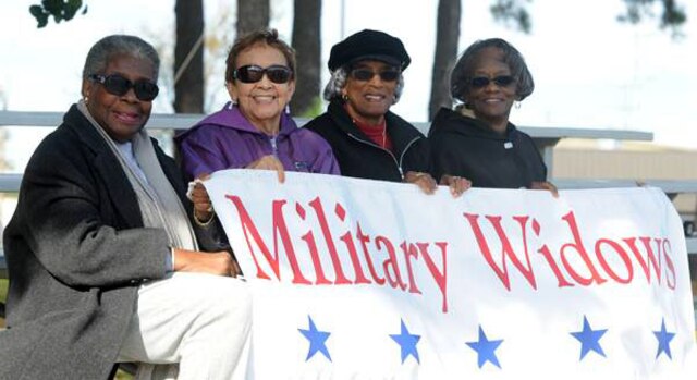 Margaret Brown, president of the Jacksonville Military Widows Association,
Lucy Kitko, Avon Jackson and Bernice Steward, members of the association  gather to honor military service members past and present during the Jacksonville Veterans Day Parade, Nov. 9. 