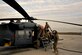 U.S. Air Force Airmen assigned to the 83rd Expeditionary Rescue Squadron perform routine maintenance on a HH-60G Pave Hawk at Bagram Airfield, Afghanistan Nov. 22, 2013. Every three days, preflight maintenance is done on the Pave Hawk to ensure that it remains safe and airworthy. (U.S. Air Force photo by Senior Airman Kayla Newman/Released)
