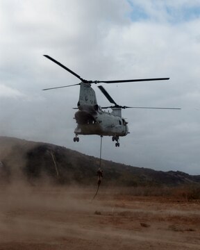 MARINE CORPS BASE CAMP PENDLETON, Calif. – A Marine serving with Kilo Company, 3rd Battalion, 5th Marine Regiment, fast ropes from a CH-46 Sea Knight helicopter during a training exercise here, Oct. 9, 2013. Fast roping allows Marines to quickly enter an area without the need for a landing zone. The technique is often employed during raids, enabling forces to rapidly secure an objective. The battalion is scheduled to deploy next spring as the battalion landing team for the 31st Marine Expeditionary Unit in Okinawa, Japan. Kilo Co. is currently assigned as the helicopter element within the battalion landing team.