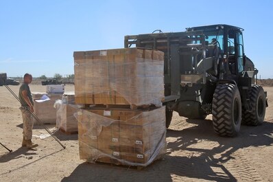 Marines with 1st Supply Battalion, Combat Logistics Regiment 15, 1st Marine Logistics Group, receive supplies from a Combat Logistics Company 16 convoy for distribution to different units during Weapons and Tactics Instructor Course 1-14 in Yuma, Ariz., Oct. 3, 2013. Daily convoys were organized by CLC-16 to provide food, fuel and equipment across Arizona in support of WTI 1-14 and traveled as far as 350 miles for a single resupply operation.  