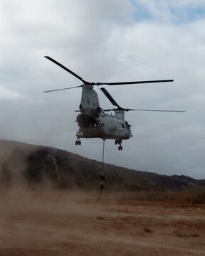 MARINE CORPS BASE CAMP PENDLETON, Calif. – A Marine serving with Kilo Company, 3rd Battalion, 5th Marine Regiment, fast ropes from a CH-46 Sea Knight helicopter during a training exercise here, Oct. 9, 2013. Fast roping allows Marines to quickly enter an area without the need for a landing zone. The technique is often employed during raids, enabling forces to rapidly secure an objective. The battalion is scheduled to deploy next spring as the battalion landing team for the 31st Marine Expeditionary Unit in Okinawa, Japan. Kilo Co. is currently assigned as the helicopter element within the battalion landing team.