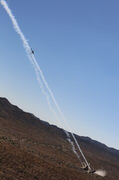 An AH-1Z super cobra attack helicopter fires a pair of 2.75-inch rockets on a designated target at a range northwest of Marine Corps Air Station Yuma, Ariz., Aug 13., in support of a team of joint terminal attack controllers with 3rd Air Naval Gunfire Liaison Company, Marine Forces Reserve, based out of the Armed Forces Reserve Center in Bell, Calif.