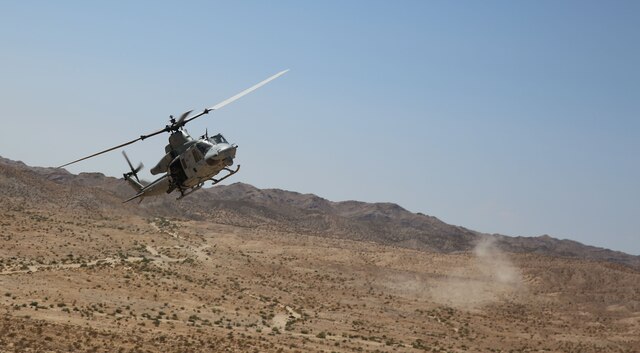 In support of a team of joint terminal attack controllers with 3rd Air Naval Gunfire Liaison Company Marine Forces Reserve, based out of the Armed Forces Reserve Center in Bell, Calif., An UH-1Y huey helicopter circles around to a target for another round of live fire drills at a range northwest of Marine Corps Air Station Yuma, Ariz., Aug. 15., in support of a team of joint terminal attack controllers with 3rd Air Naval Gunfire Liaison Company Marine Forces Reserve, based out of the Armed Forces Reserve Center in Bell, Calif.