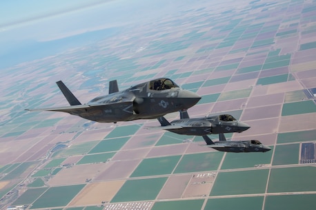 Three F-35B Lightning II Joint Strike Fighters with Marine Fighter Attack Squadron 121, 3rd Marine Aircraft Wing, fly in formation during fixed-wing aerial refueling training over eastern California, Aug. 27. VMFA-121 is the first F-35B squadron in the Marine Corps.