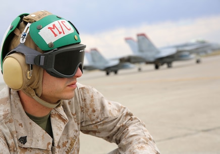 Sgt. Ryan Shouse, a maintenance control non-commissioned officer with Marine Fighter Attack Squadron 232 and a Scottsburg, Ind., native, watches as F/A-18C Hornets launch from the flight line aboard Mountain Home Air Force  Base, Idaho, July 24. Marines with maintenance control ensure all maintenance is completed and there are no issues with the aircraft.