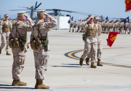 Col. Patrick Gramuglia, left, former commanding officer of Marine Aircraft Group 16, and Col. Anthony Bianca, right, incoming commanding officer of MAG-16, salute during a change of command ceremony aboard Marine Corps Air Station Miramar, Calif., Aug. 8. Gramuglia relinquished his duties to Bianca, who came from the previous command of Marine Medium Tiltrotor Squadron 261.