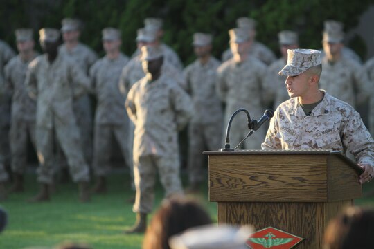 Sgt. Roberto Gonzalez with Marine Wing Support Squadron 373, and the reviewing officer for the 9/11 Warrior Recognition Evening Colors Ceremony speaks to guests aboard Marine Corps Air Station Miramar, Calif., Sept. 11. The ceremony was part of the the committed and engaged leadership initiative, which aims to empower noncommissioned officers with tasks they normally would not have the opportunity to perform.