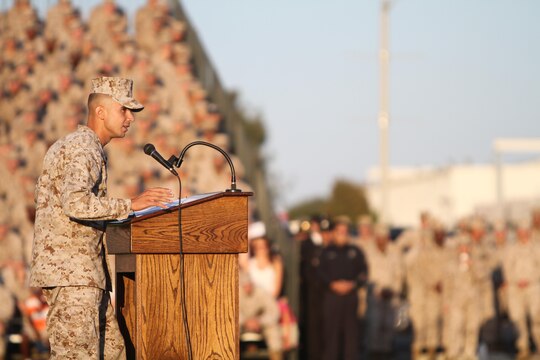 Sgt. Roberto Gonzalez with MWSS 373, and the reviewing officer for the 9/11 Warrior Recognition Evening Colors Ceremony speaks to guests aboard Marine Corps Air Station Miramar, Calif., Sept. 11. The ceremony was part of the the committed and engaged leadership initiative, which aims to empower noncommissioned officers with tasks they normally would not have the opportunity to perform.