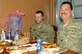 Lt. Col. Jonathon McBeth and his son, Senior Airman Jonathan McBeth, share a birthday meal together on Bagram Airfield, Afghanistan, Sept. 17, 2013. 