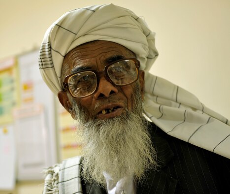 An Afghan patient reads an eye chart during an exam after receiving new prescription glasses during an eye glasses clinic in the Korean Hospital on Bagram Air Field, Afghanistan, Sept. 18. Five months ago after arriving on Bagram, he established a program to provide glasses to Afghan and coalition members in need. The glasses come from former patients and non-profits. This is the second time they have held an eye glasses clinic here. Thus far he has provided glasses to more than 40 people. He is deployed from Keesler Air Force Base, Miss. (U.S. Air Force photo/ Staff Sgt. Stephenie Wade)
