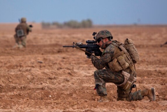 U.S. Marine Gunnery Sgt. Donnie Farmer, a Grants Pass, Ore., native serving with Georgia Liaison Team 10, Regional Command (Southwest), provides security during a combined Georgian-Marine security patrol near Combat Outpost Eredvi, Helmand province, Afghanistan, Nov. 5, 2013. Daily security patrols improved security around the base and connected base personnel with the concerns of local Afghans. 