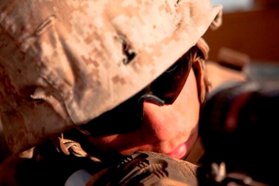 Lance Cpl. Dustin Dodd, a Habersham, Ga., native and turret gunner with Combat Logistics Regiment 2, Regional Command (Southwest), looks through the sights on his machine gun during a combat logistics patrol in Helmand province, Afghanistan, Aug. 28, 2013. Dodd commonly stands in the turret for more than eight consecutive hours at a time on convoys that can last for days.