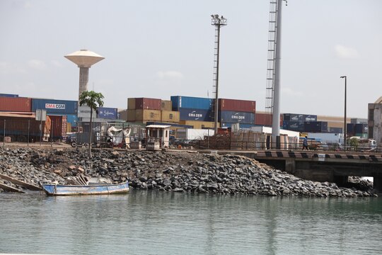 A group of shipping containers sit at the Port of Lomé, Togo, after being offloaded, March 25, 2014.