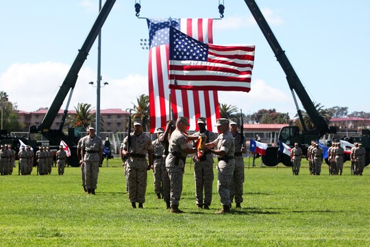 Sergeant Maj. Brian Milton (left), regimental sergeant major and Col. Erik B. Kraft (right), regimental commanding officer, both with Headquarters Regiment, 1st Marine Logistics Group, retire the Combat Logistics Regiment 17 colors during a ceremony re-designating the unit as HQ Reg. aboard Camp Pendleton, Calif., March 31, 2014. The re-designation took place on the eighth anniversary of CLR-17’s beginning in 2006.