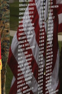 The 6-67 Memorial reflects the U.S. flag during the memorial’s dedication at The Basic School on April 25, 2014. The memorial was dedicated to the class who suffered 50 casualties and more than 200 wounded Marines. 