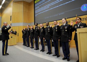 Sgt. Maj. of the Army Raymond F. Chandler III leads the induction of 10 soldiers assigned to DIA to the honorable title of noncommissioned officer July 29.