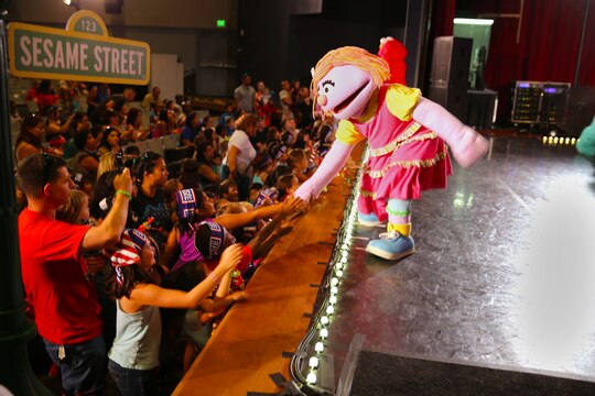 Katie, a military character exclusively designed for military families, greets children during a Sesame Street/USO performance at the Camp Pendleton Base Theater, July 31.



The Sesame Street/USO Experience for Military Families is playing Thursday, July 31 and Friday, Aug. 1 at the base theater for military ID holders and their guests. This year marks the tours fourth year visiting military installations in the U.S. and abroad. 



“The Sesame Street/USO tour was created 6 years ago and we couldn’t be more proud of all the moments we have had at home and abroad. As we celebrate the kick-off of our latest installment and venture out to visit, entertain and uplift even more military families this year,” said John I. Pray, Jr. USO President and CEO. “We are grateful to our family at Sesame Street who not only understand the unique challenges today’s military families face but also share our commitment to supporting them every step of the way.”


