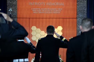 Lt. Gen. Michael Flynn salutes DIA’s fallen during a 2013 observance ceremony at DIA’s Patriots Memorial.