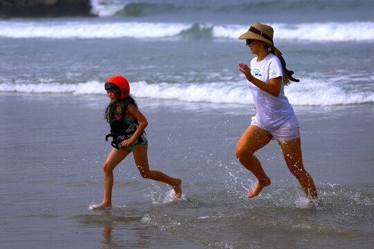 Laura Delpena, an event volunteer, and Kaylee, 7, enjoy time in the ocean during the Exceptional Family Member Program beach event at Del Mar Beach, Aug. 2-3. 

The Best Day Foundation Orange County Chapter hosted the event for special needs children that are enrolled in the EFMP. The event provided activities such as surfing, body boarding, kayaking and more. 

“For families like us, we don’t have a lot of opportunities for our kids to experience what the normal family might,” said Jolanda Graham, parent and volunteer EFMP family representative.  

Involved parents such as Graham also appreciate experienced volunteers who make these activities safe and possible.
