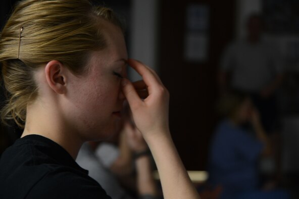U. S. Army Spec. Briana Smith, a lab technician with the 379th Blood Support Detachment out of Edgemont, Pa., clears her mind and practices her breathing during a variation of the sukhasana pose during a yoga class June 24, 2014 at the Craig Joint Theater Hospital at Bagram Airfield, Afghanistan. Smith, a native of Sugarloaf, Pa., is one of many staff members that attend one of the two yoga classes at the hospital. The class allows her a chance to relax after a busy or stressful day at work.  (U.S. Air Force photo by Master Sgt. Cohen A. Young/Released)