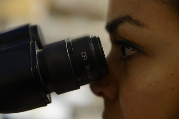 U.S. Air Force Senior Airman Kandie Ibarra, a lab technician assigned to the 455th Medical Support Squadron, Craig Joint Theater Hospital, Bagram Airfield, Afghanistan examines a blood sample June 23, 2014.  Ibarra, along with four other lab techs and an officer-in-charge, run Operation Enduring Freedom’s busiest blood bank. Ibarra, a native of Blackfoot, Idaho, is deployed from Keesler, Miss. (U.S. Air Force photo by Master Sgt. Cohen A. Young/Released)