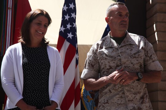 Major Gen. Vincent A. Coglianese, commanding general, 1st Marine Logistics Group, stands next to his wife, Mary Coglianese, as he speaks after his promotion to major general aboard Camp Pendleton, Calif., Aug. 19, 2014.