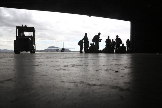 United States Marine Critical Skills Operators with 1st Marine Special Operations Battalion, Marine Corps Forces, Special Operations Command, wait for their double-bag static line (DBSL) parachute training to commence, at a secluded Arizona flightline, Aug 26, 2014.  The DBSL course is an introduction to the High Altitude, High Opening (HAHO) insertion method utilized by Special Operations Forces. (U.S. Marine Corps Photo by Lance Cpl. Steven M. Fox/Released)