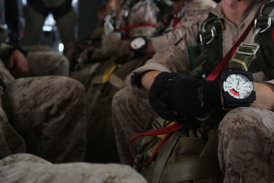 United States Marine Critical Skills Operators with 1st Marine Special Operations Battalion, Marine Corps Forces, Special Operations Command, wait aboard a CASA 212 aircraft in the process of gaining altitude to conduct a double-bag static line (DBSL) jump, during a DBSL parachute training course, Aug 26, 2014, in rural Arizona.  The DBSL course is an introduction to the High Altitude, High Opening (HAHO) insertion method utilized by Special Operations Forces. (U.S. Marine Corps Photo by Lance Cpl. Steven M. Fox/Released)