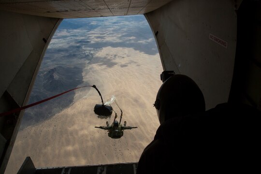 A U.S. Marine Critical Skills Operator with 1st Marine Special Operations Battalion, Marine Corps Forces, Special Operations Command, executes a double-bag static line (DBSL) jump, during a DBSL parachute training course , Aug 26, 2014, conducted in rural Arizona.  The DBSL course was an introduction to the High Altitude, High Opening (HAHO) insertion method utilized by Special Operations Forces. (U.S. Marine Corps Photo by Lance Cpl. Steven M. Fox/Released)