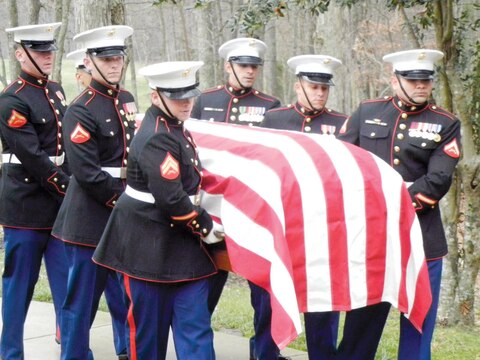 Marines transport the casket carrying the body of a fallen Marine during a military funeral at Quantico National Cemetery on Dec. 5.
