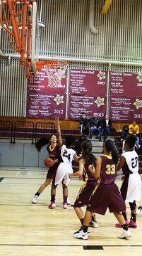 Ani Erhart, a junior with the Matthew C. Perry Lady Samurai basketball team, prepares to take a shot during the second of two home games against the Zama American High School Trojans, Dec. 13, 2014, at the high school gymnasium aboard Marine Corps Air Station Iwakuni, Japan. The Lady Samurai lost both games against the Trojans, 36-26 in the first and 33-27 in the second. 