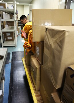 Marines at the Mainside Postal Office aboard Marine Corps Air Station Iwakuni, Japan, continue to push through the demanding overload of mail during the busiest time of the year. More than 700 pounds of mail are sent per day and 3,500 pounds of mail are received per day during the busy holiday season months of late November to mid-January.
