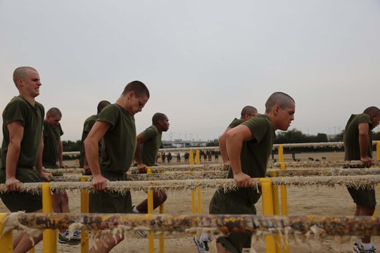 Recruits of Echo Company, 2nd Recruit Training Battalion, perform dips at Marine Corps Recruit Depot San Diego, Dec. 11. Recruits were not permitted breaks during the duration of the Circuit Course. 