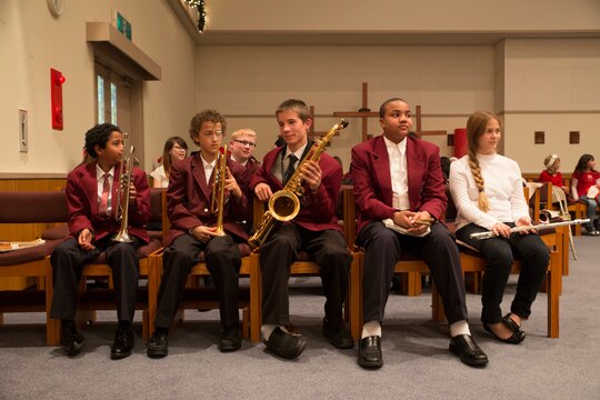 Students from Matthew C. Perry Schools prepare to perform in the holiday concert, Dec. 15, 2014, at the Marine Memorial Chapel aboard Marine Corps Air Station Iwakuni, Japan. The concert was held for students from Higashi Junior High School, Agenosho Elementary School and M.C. Perry Schools.