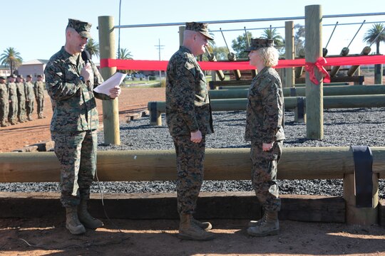 Cpl. Megan Scullin, a combat videographer with 3rd Marine Aircraft Wing (MAW), gets meritoriously promoted by Maj. Gen. Steven Busby, commanding general of 3rd MAW, during a ribbon-cutting ceremony aboard Marine Corps Air Station Miramar, Calif., Jan. 6. Scullin attended the Corporals indoctrination and Corporals Course immediately following her promotion.