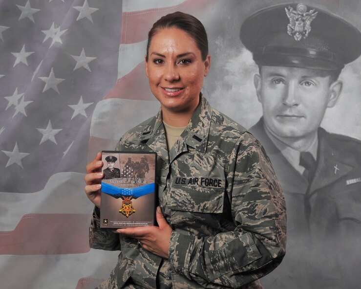 Air Force 1st Lt. Kristina Roberts, an Air National Guard air weapons officer deployed to the 727th Expeditionary Air Control Squadron, poses for a photo here, Jan. 6, 2014. Roberts great uncle Chaplain (Capt.) Emil Kapaun was posthumously awarded the Medal of Honor. (Photo Illustration by Staff Sgt. Michael Means/Released) 
