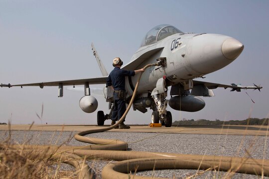 Cpl. James George refuels an FA-18D Hornet at Wing One Royal Thai Air Force Base, Nakhon Ratchasima, Kingdom of Thailand, Feb. 6 in preparation for Exercise Cobra Gold 2014. CG 14 is a joint, multinational exercise conducted annually in the Kingdom of Thailand aimed at increasing readiness and interoperability of the Thai, U.S. and other fully participating military forces. George is a power line plane captain with Marine All Weather Fighter Attack Squadron 242, Marine Aircraft Group 12, 1st Marine Air Wing, III Marine Expeditionary Force. The aircraft is with VMFA(AW)-242, MAG-12.